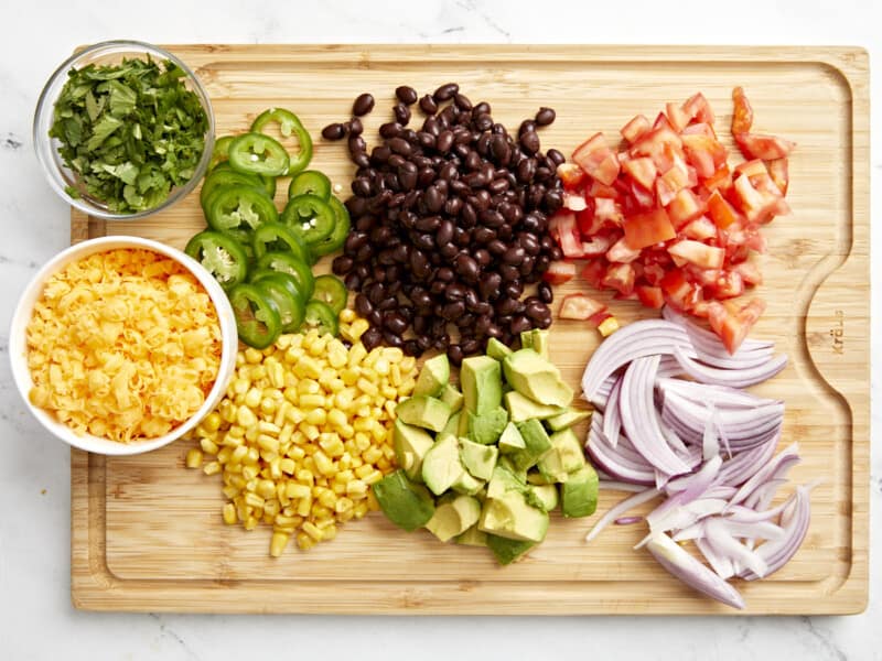 overhead view of chopped veggies on a cutting board.