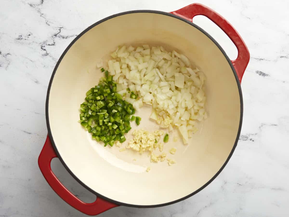 Diced onion, jalapeno, and garlic in a dutch oven.