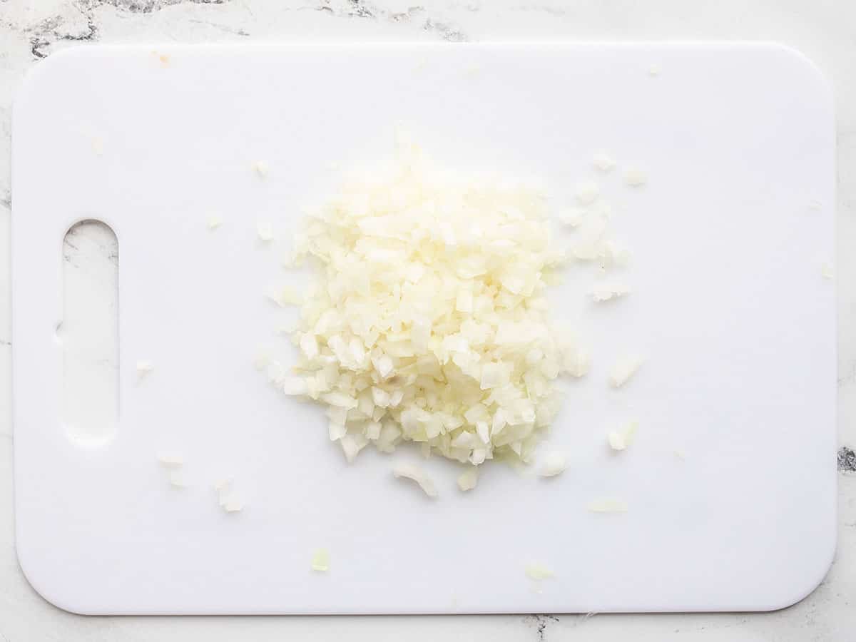 minced onion on a cutting board