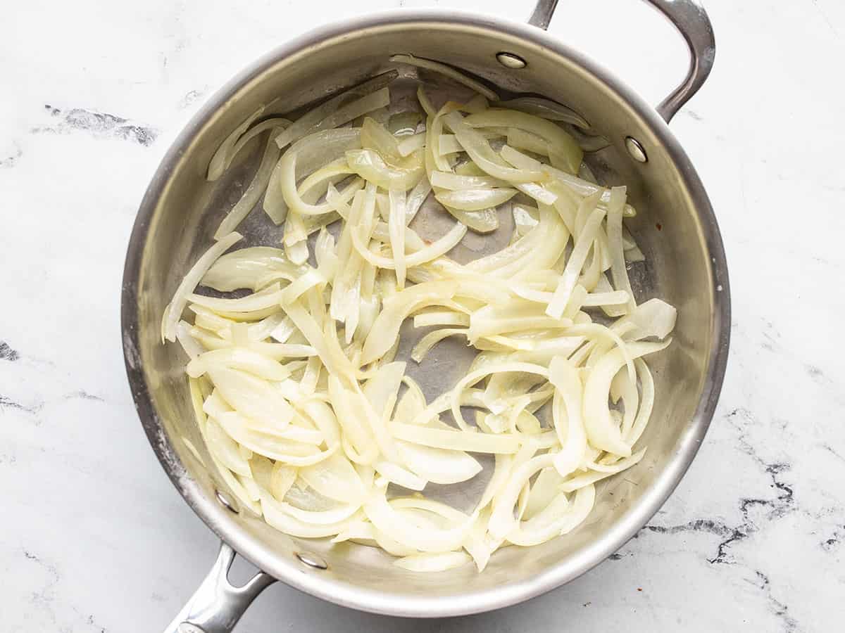 Sautéed onions in a skillet.