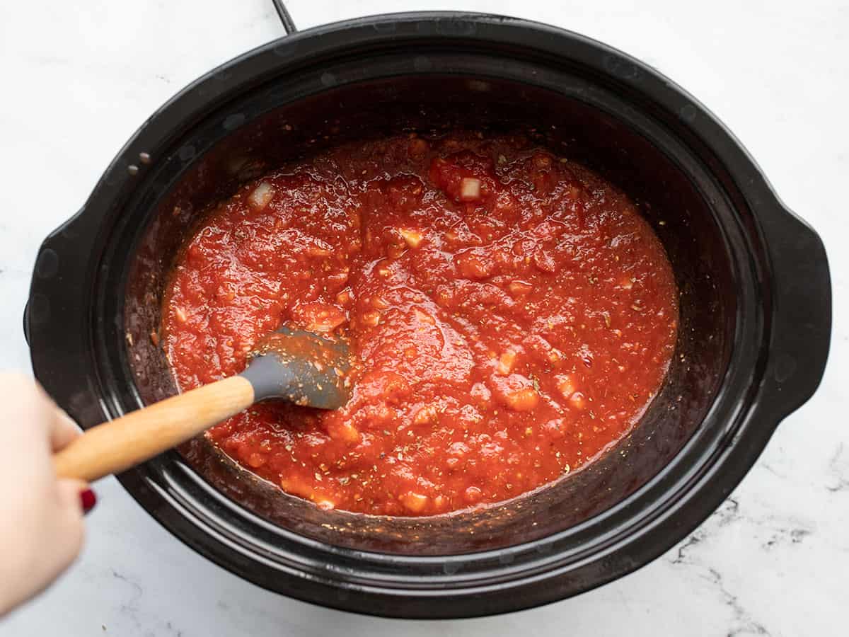 Sauce ingredients being stirred together before cooking