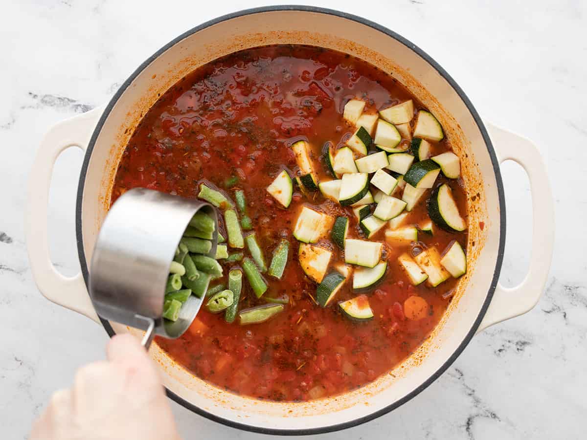 Zucchini and green beans added to the soup