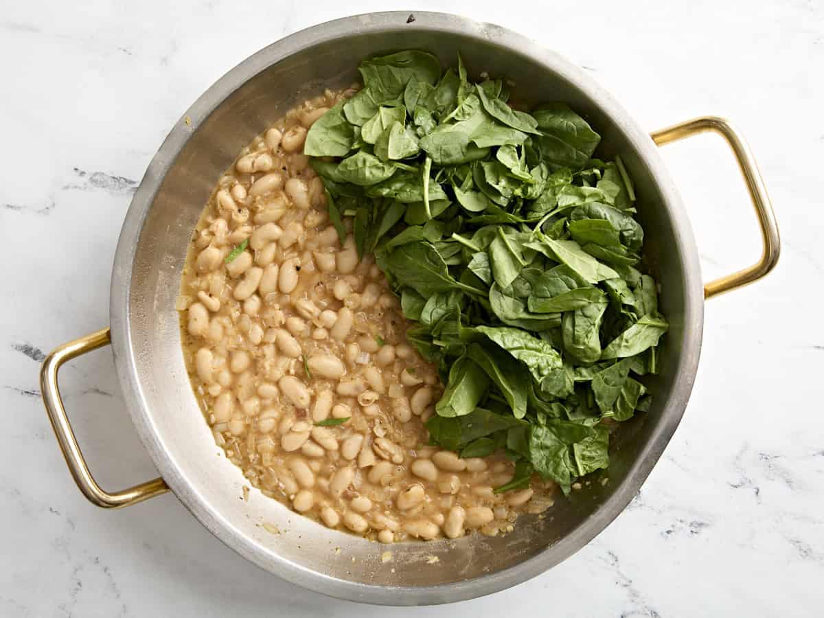 Spinach added to skillet.