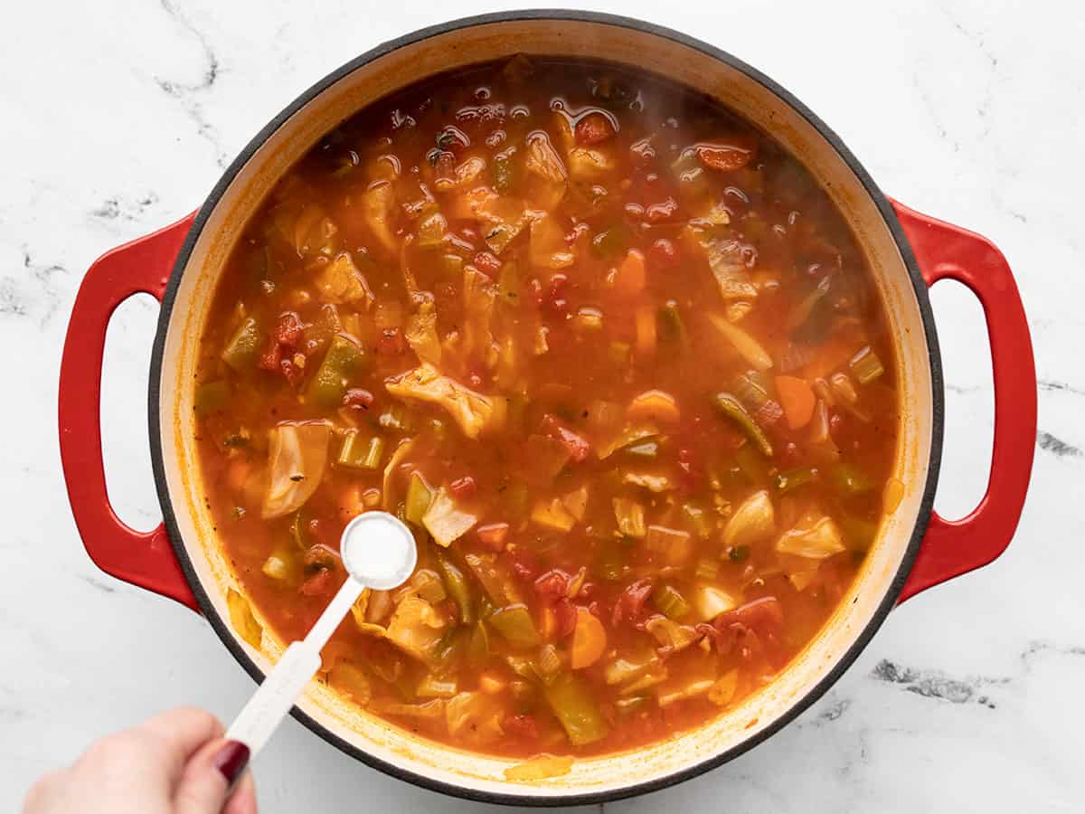 Salt being added to the soup