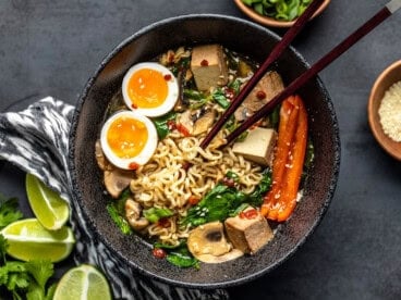 Overhead view of the finished bowl of upgraded instant ramen with chopsticks in the center.