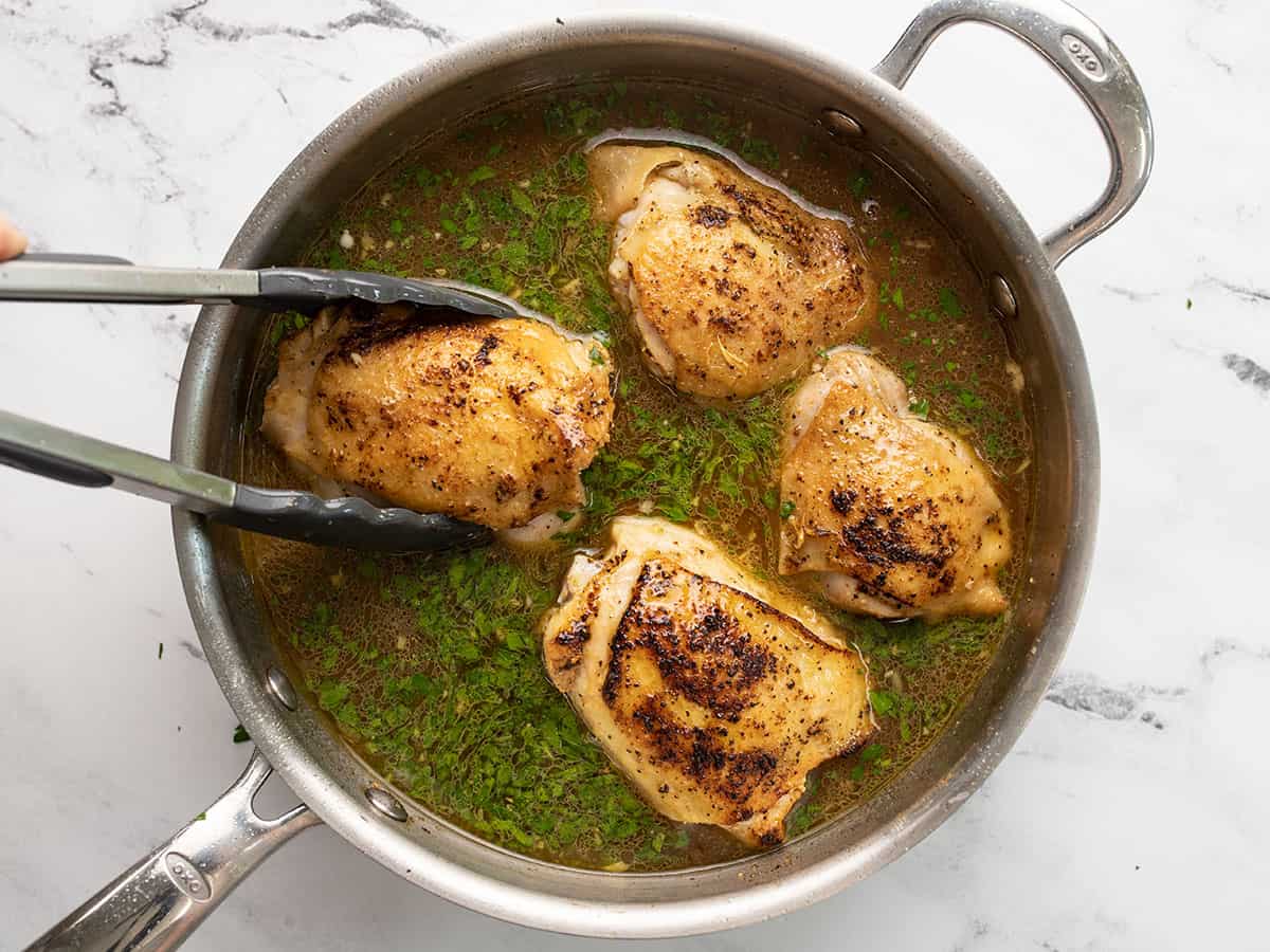 Chicken thighs added back to the pot.