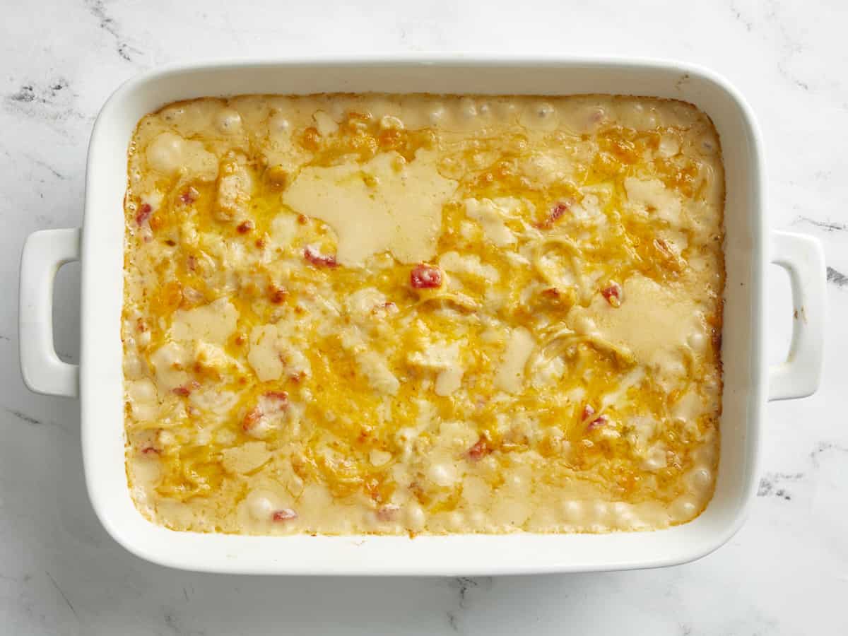 Overhead view of cooked chicken spaghetti in a casserole dish.