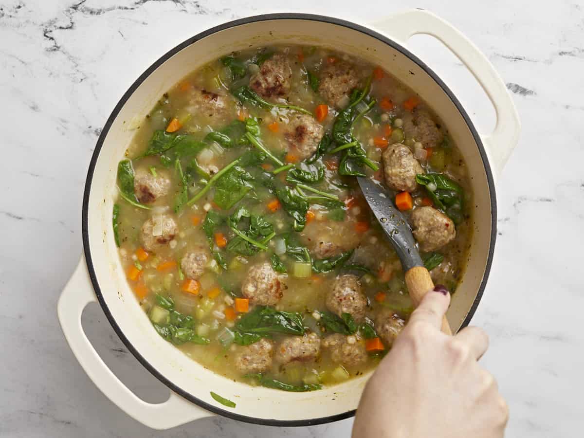 Finished Italian Wedding Soup in the pot being stirred. 