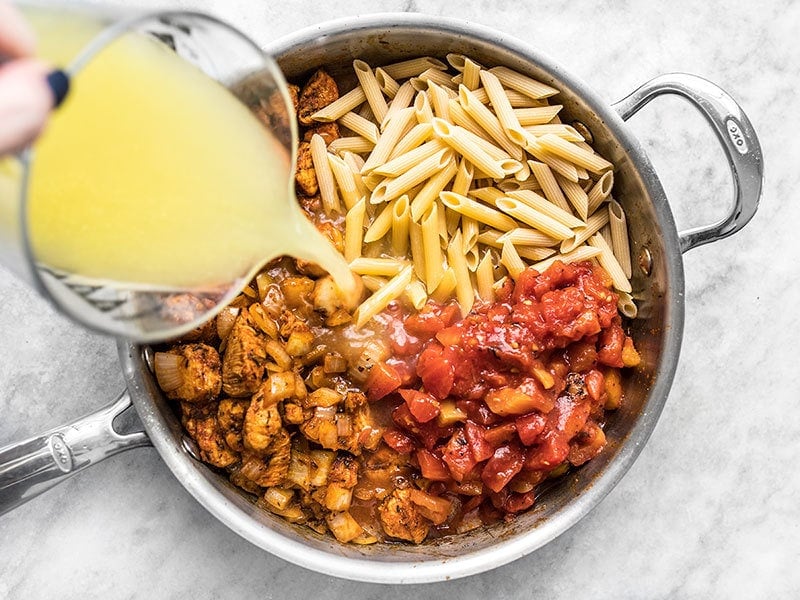 Add Pasta Fire Roasted Tomatoes and Chicken Broth