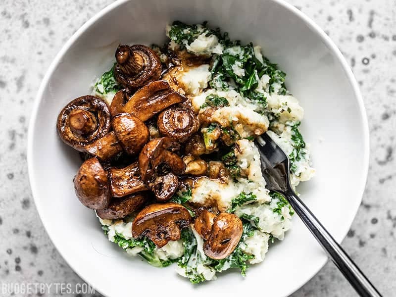 Close up of a bowl of Balsamic Roasted Mushrooms with Herby Kale Mashed Potatoes