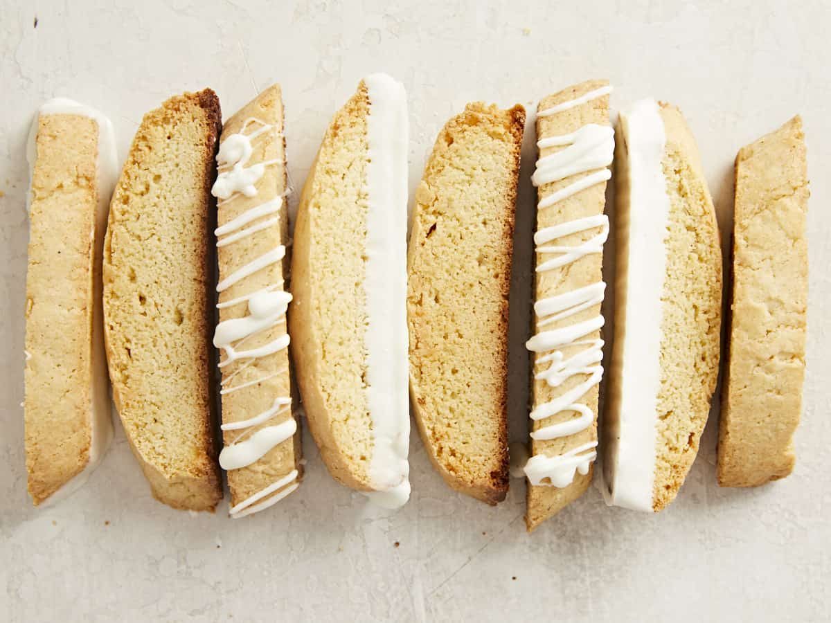 Biscotti lined up in a row showing different decorations.