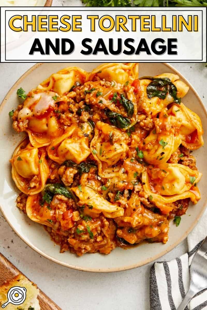 Overhead view of cheese tortellini and sausage on a plate with title text at the top.