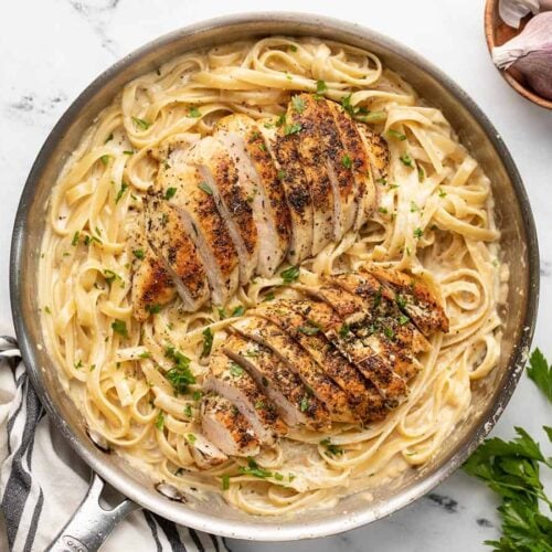 Overhead view of chicken alfredo in the skillet.