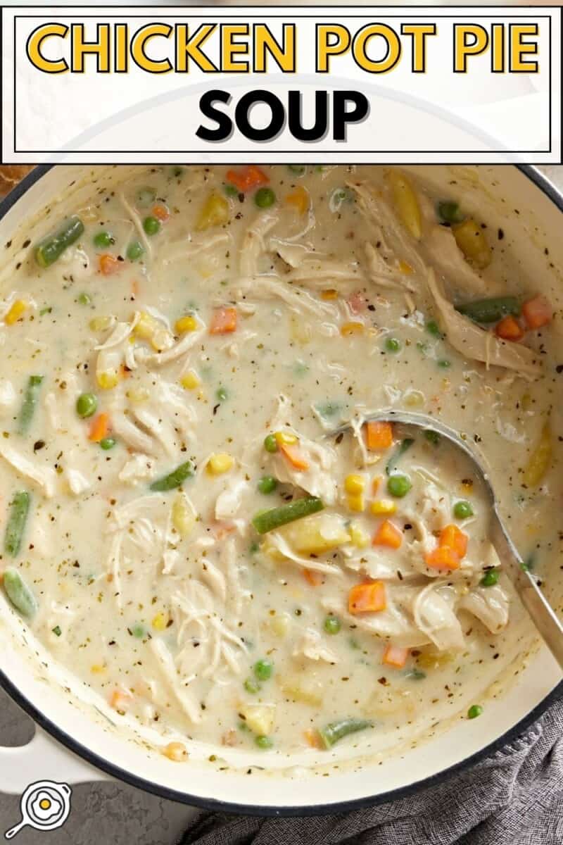 Overhead view of Chicken Pot Pie Soup in a large dutch oven pot with title text at the top.