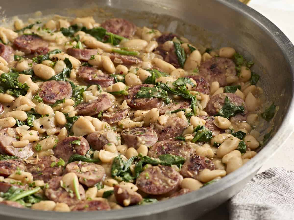 close up front view of chicken sausage white bean skillet.