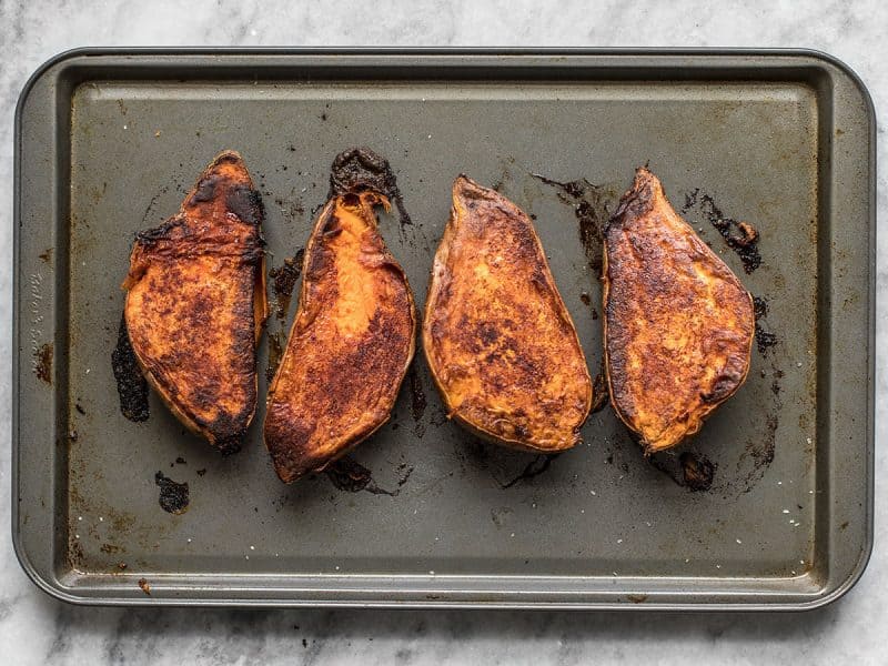 Cinnamon Roasted Sweet Potatoes turned over on baking sheet