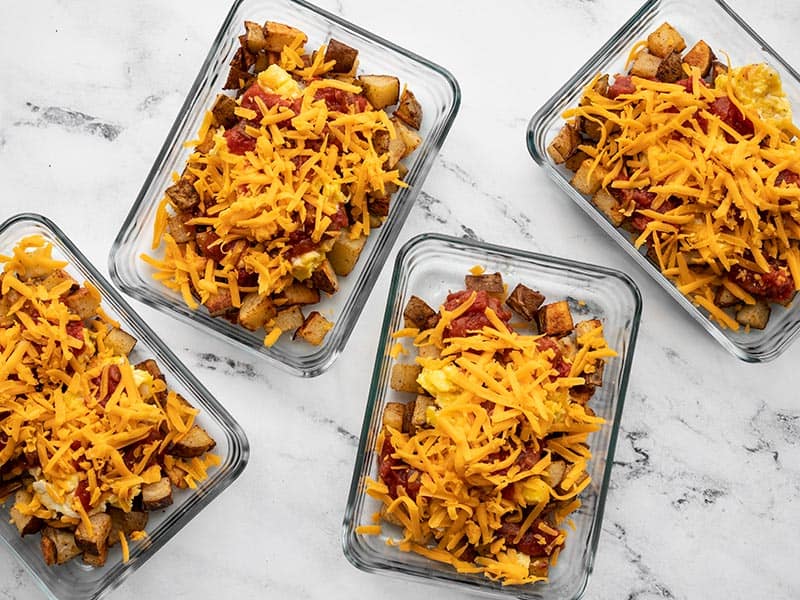 Four rectangular glass containers full of Country Breakfast Bowls