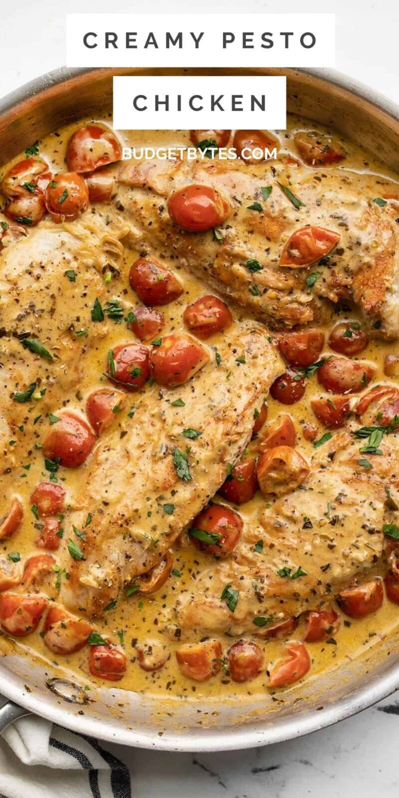 close up overhead shot of creamy pesto chicken in the skillet.