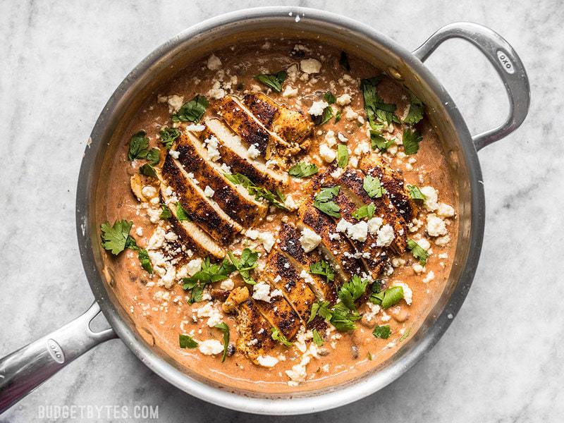 Finished creamy salsa chicken skillet with cilantro and cheese sprinkled over top