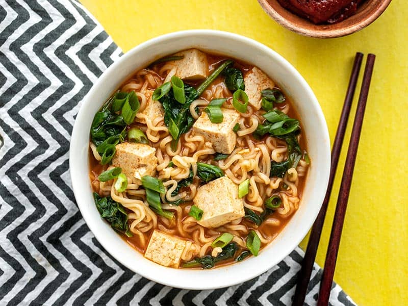 One bowl of gochujang ramen with tofu, chopsticks on the side