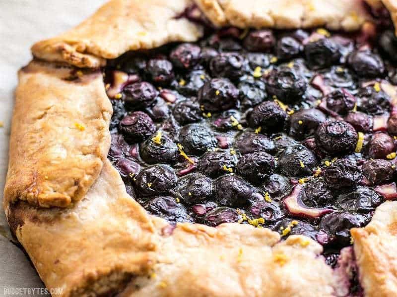 This Lemon Blueberry Cream Cheese Galette is a simple and rustic dessert that can be made with frozen or fresh berries. BudgetBytes.com