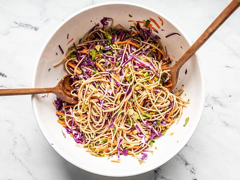 Salad ingredients tossed together in the bowl.