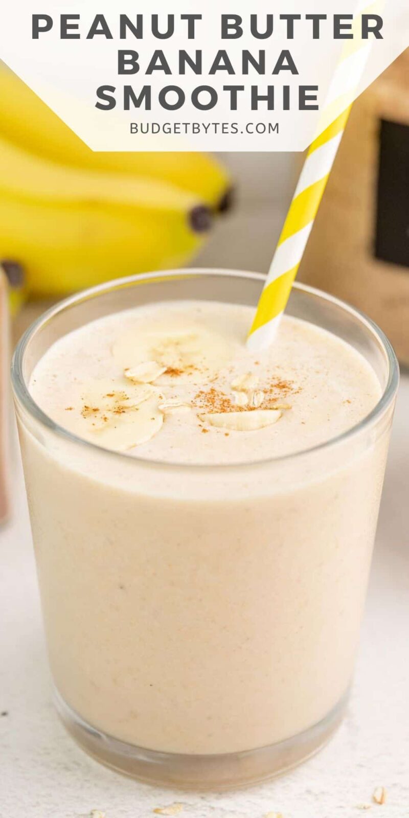 Peanut Butter Banana Smoothie in a glass with a straw.