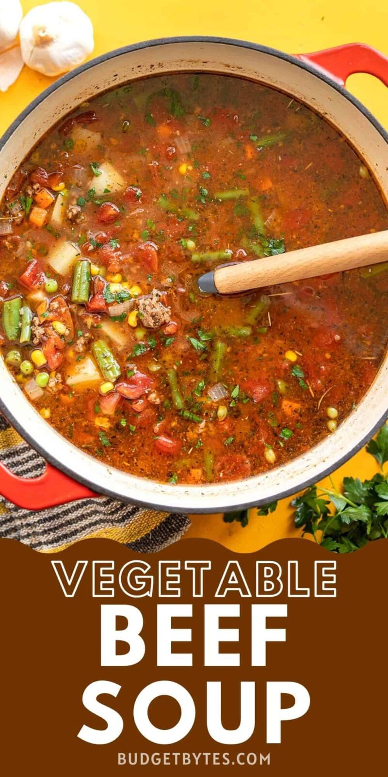 Overhead view of a pot of vegetable beef soup.