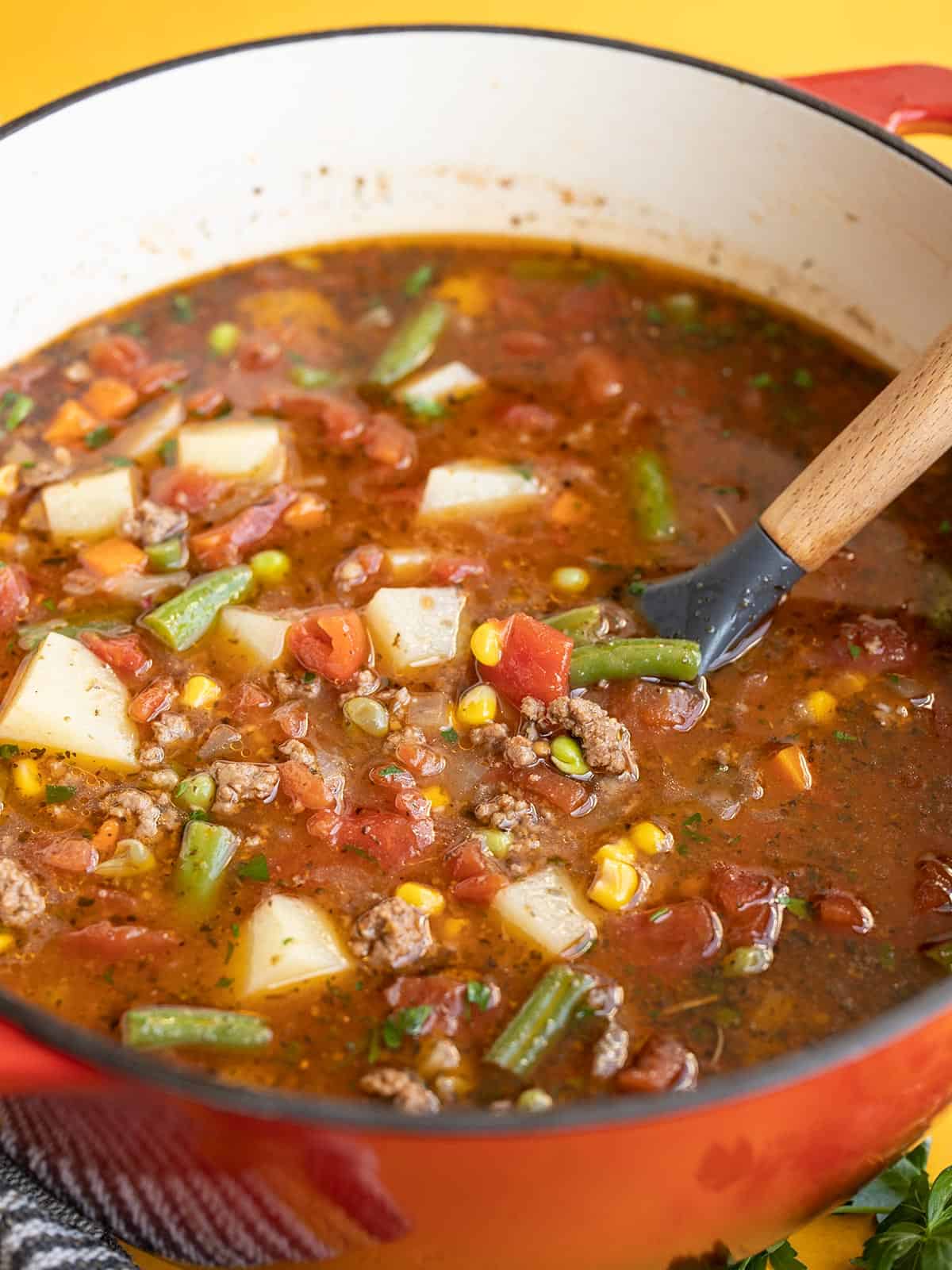 Side view of the pot of vegetable beef soup.