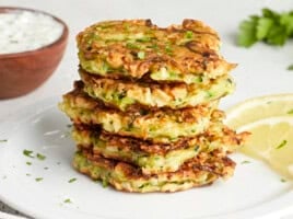 Front side view of a stack of zucchini fritters.