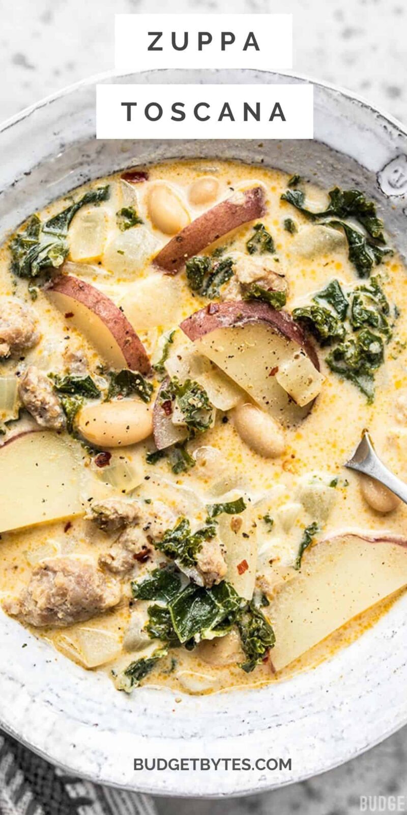 close up view of a bowl of zuppa toscana with title text at the top